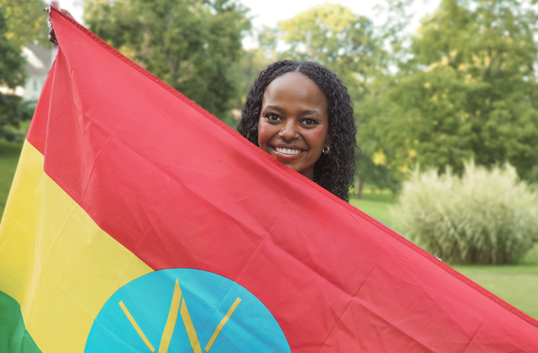 Bella Jessee holds the Ethiopia flag.